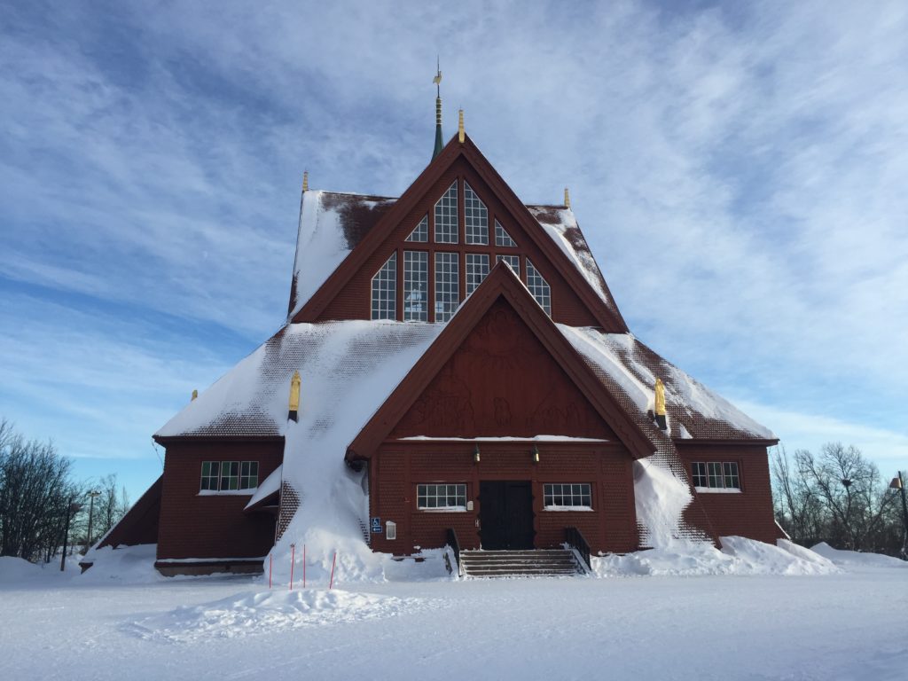 a snow-covered church in kiruna sweden