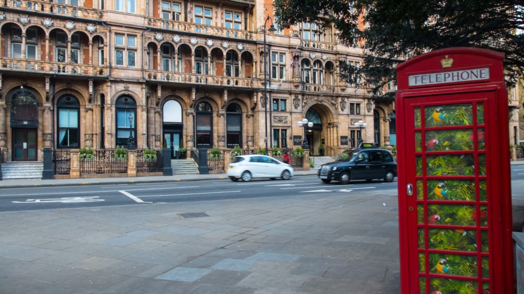 a phone booth with funky wallpaper in london