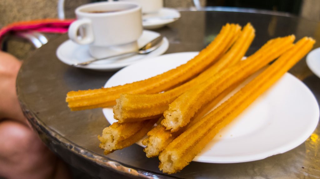 Churros with a cup of coffee in Madrid