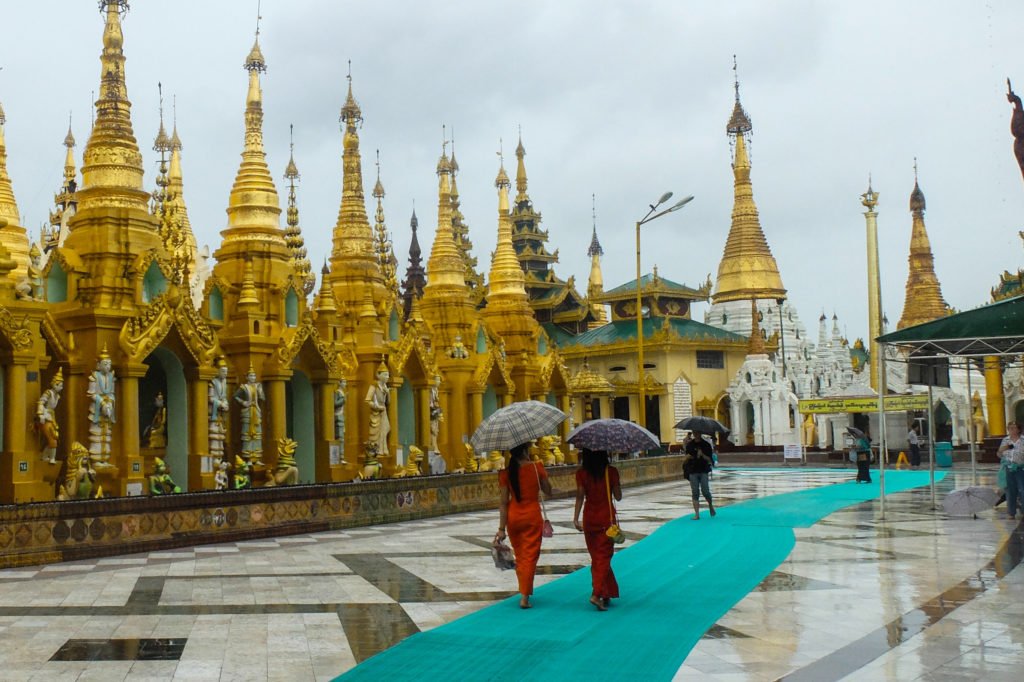 Girls with umbrellas in Myanmar