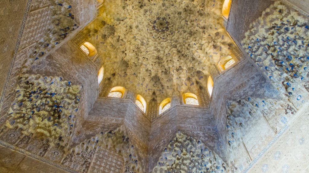 A view of the star-shaped vaulted ceiling in the Nasrid Palaces of Granada