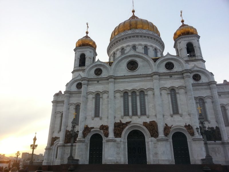 Gold domes on the church in Russia with white marble