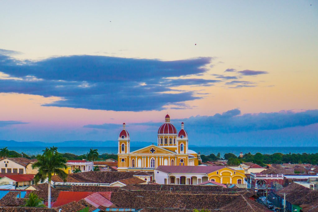 brilliant skyline view of the granada cathedral at sunset with lovely colors.