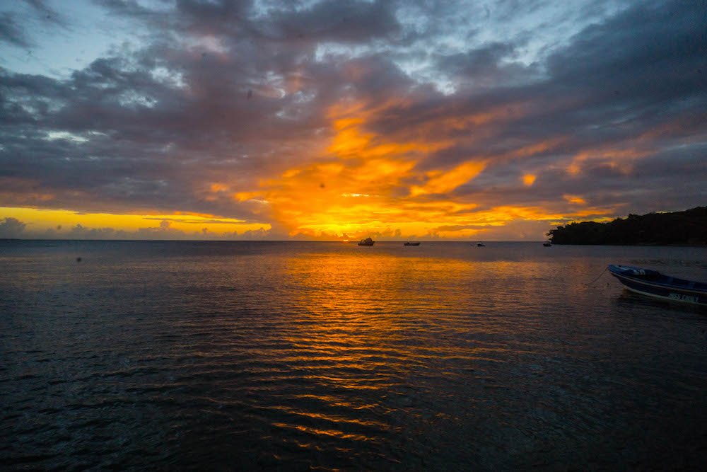 sunset near the mangroves of nicaragua with water and boats