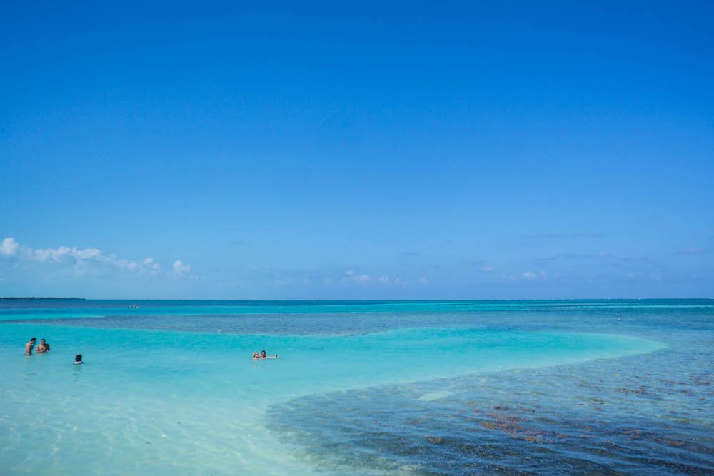 People swimming in the shallows waters near the Split