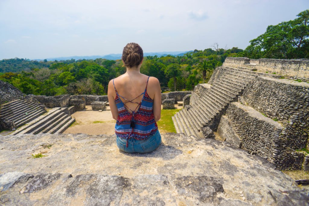 Allison sitting atop a pyramid in the Caracol Complex of ruins