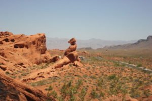 Photo of Balanced Rock, a rock balancing on another rock in the valley of fire red rock landscape