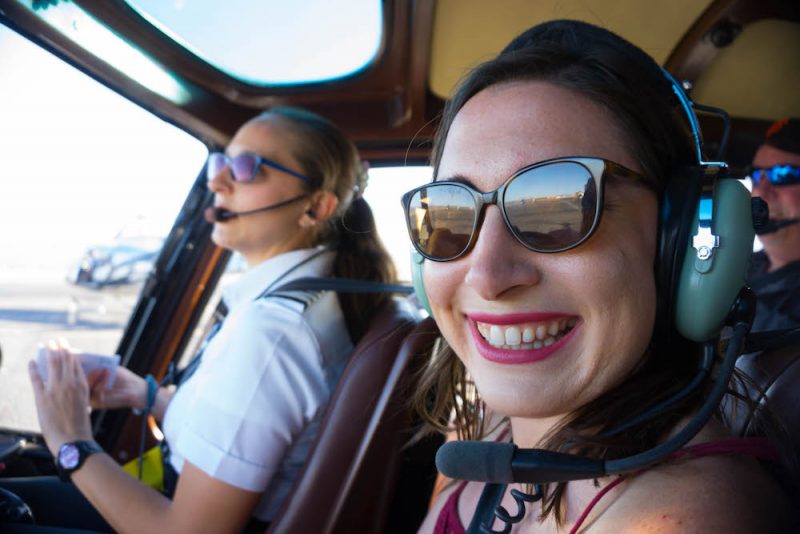 Allison in a helicopter taking off for the Grand Canyon