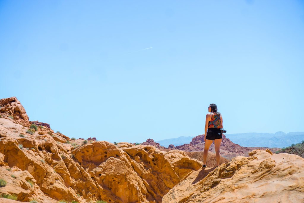 Allison standing on a rock near the Visitor Center of Valley of Fire