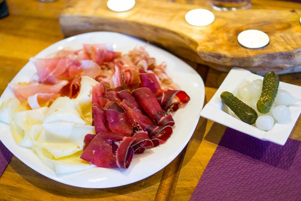 Delicious cured meats and pickles at a small restaurant