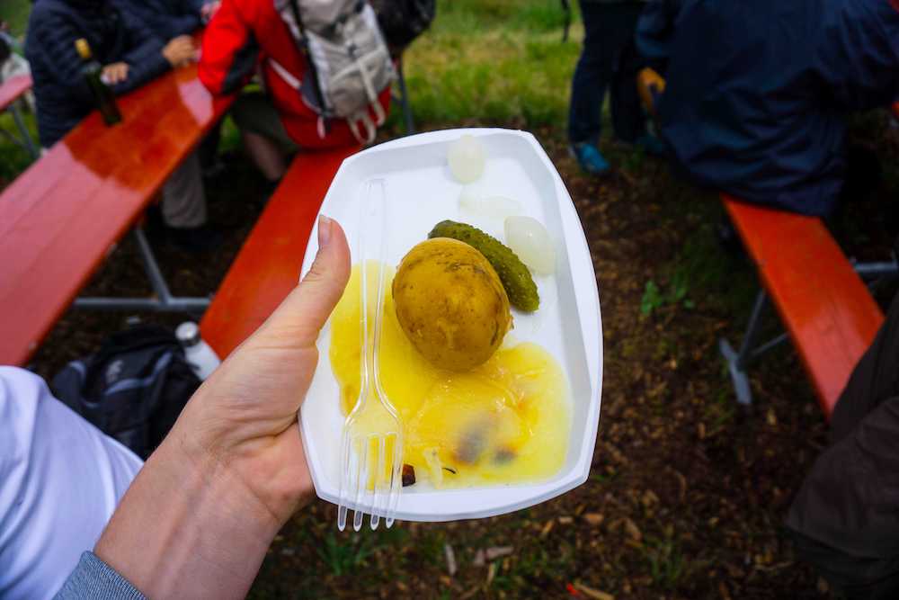 A cheese plate outside at a festival in Switzerland