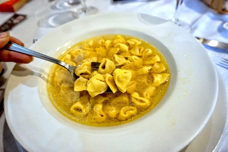 bowl of tortellini and soup