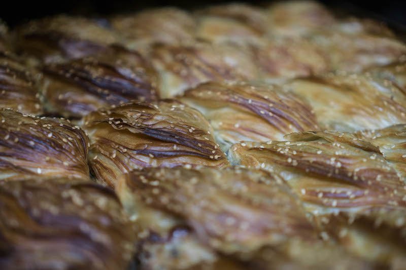 Close up detail of flaky breakfast pastry.