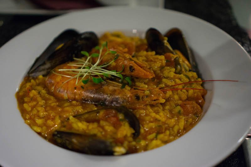 a dish of shrimp and mussel risotto