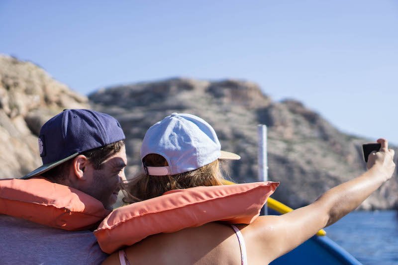 couple taking a selfie at the blue grotto