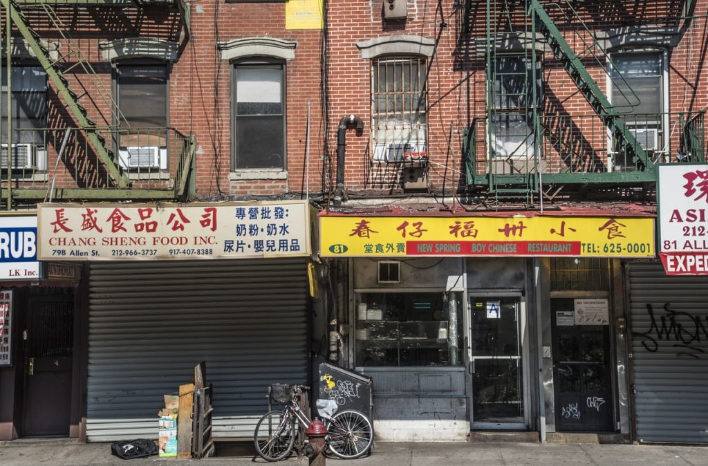 bicycle in front of restaurants in chinatown new york