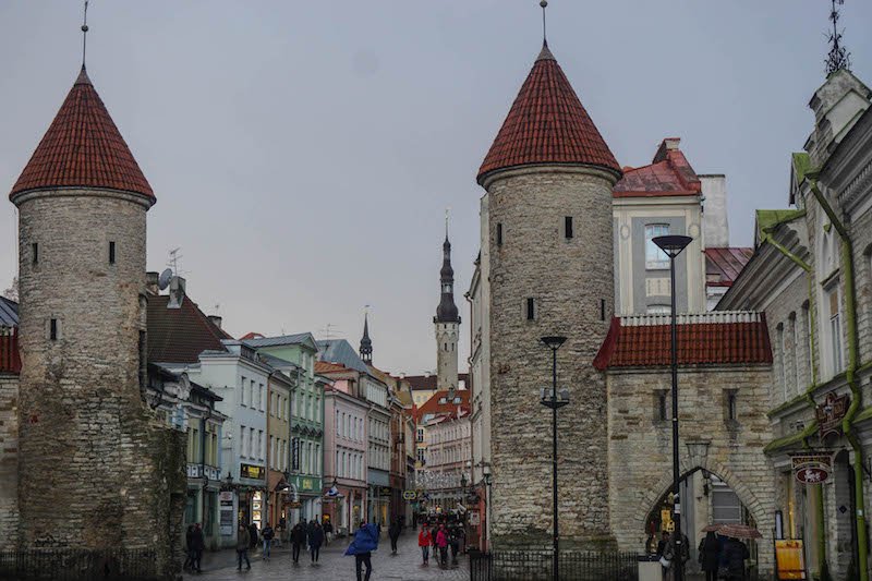 Overcast view around sunset of the gates in Tallinn with medieval turret style walls