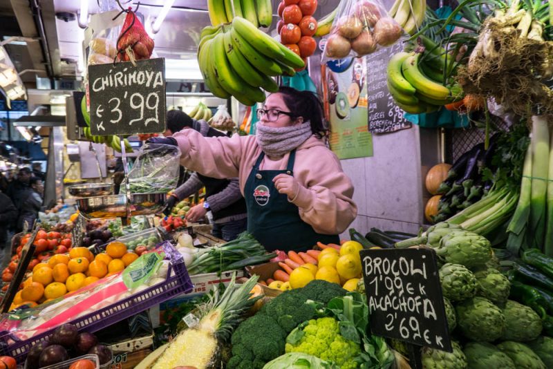 view of a person visiting la boqueria market in barcelona