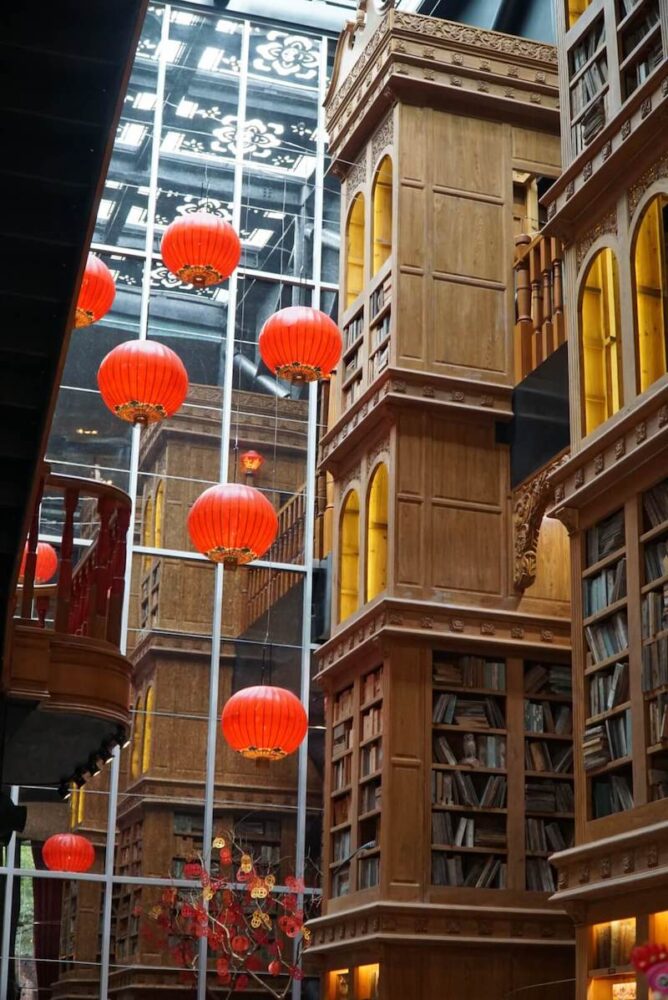 Colorful interior of the Miyahara building with red lanterns and bookcase-looking architecture