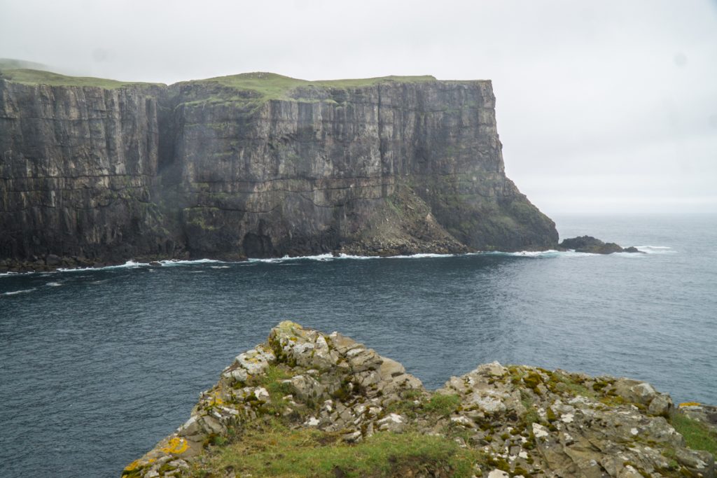 large cliffs in vagur sudoroy and calm sea