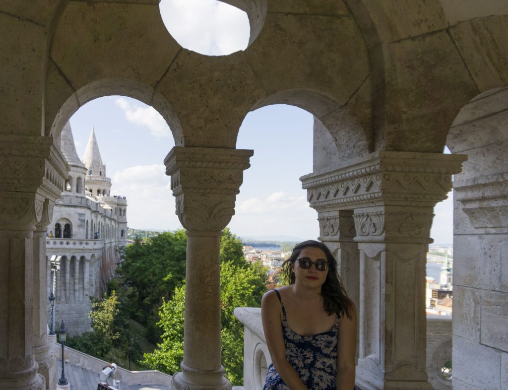 Allison in Budapest at Fisherman's Bastion in a sundress on a summer day