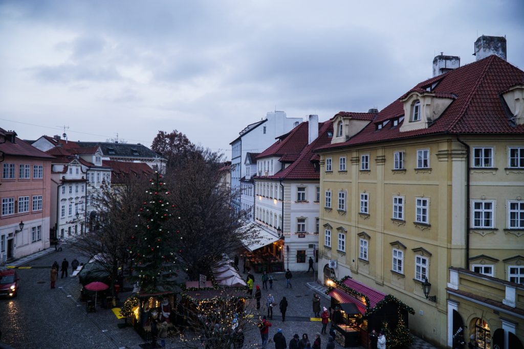 The small Christmas market on an overcast day in winter in Prague in Mala Strana after you cross the Charles Bridge on your way to the Prague Castle.