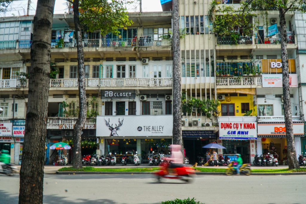 saigon street blurry motorbike and still buildings