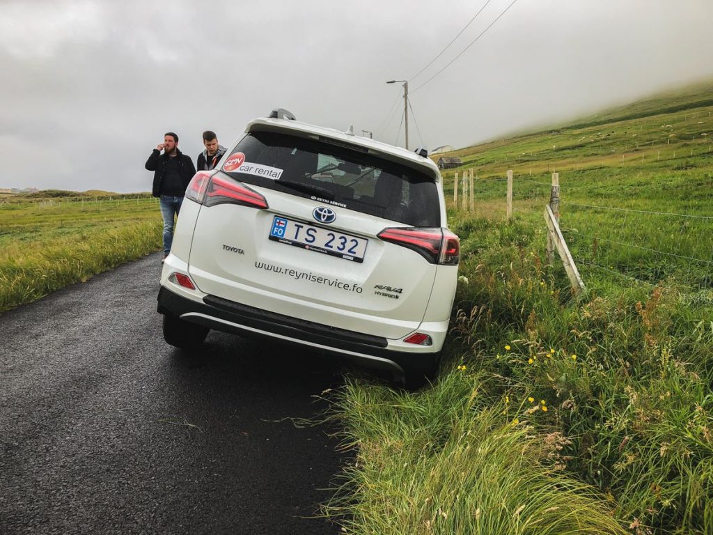 a rental car tipped over and fallen into a ditch!