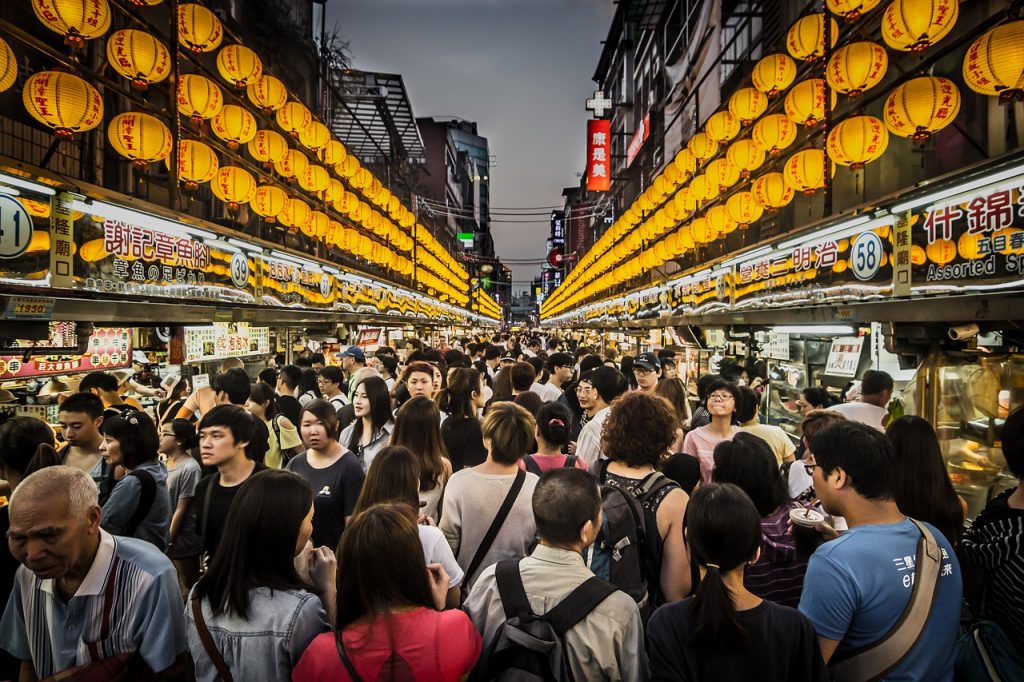 people enjoying the night market in keelung