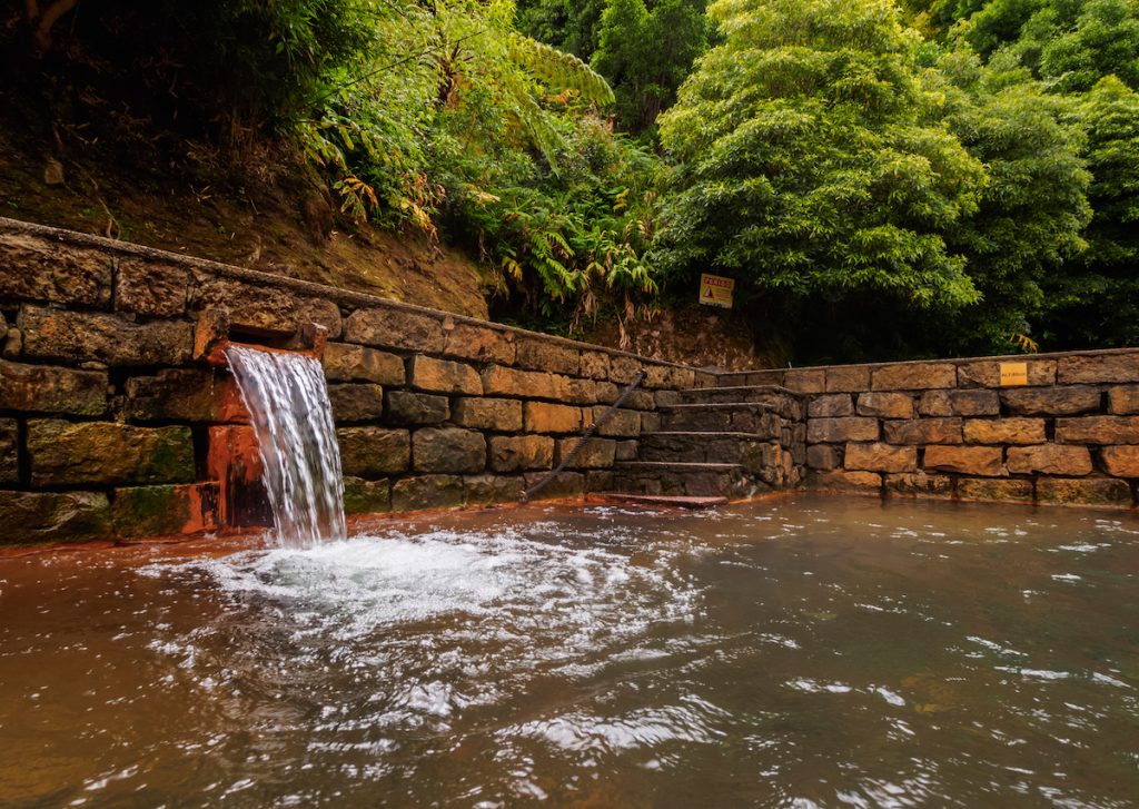 a small spring fed by mineral water on the azores islands