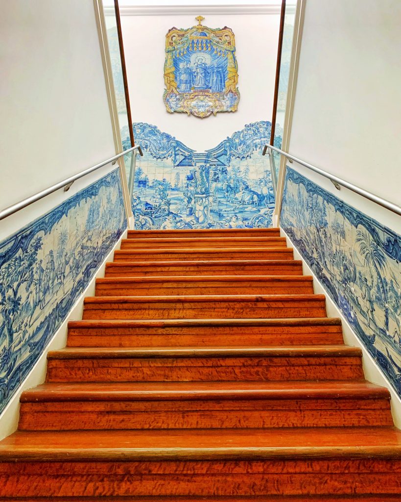 The staircase at the Museo Dos Azulejos in Lisbon Portugal as seen from the tile-covered walls and view