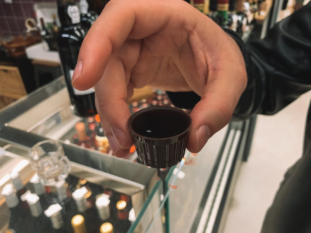 A cup of ginjinha liquor in a typical chocolate cup, a traditional taste of Portugal