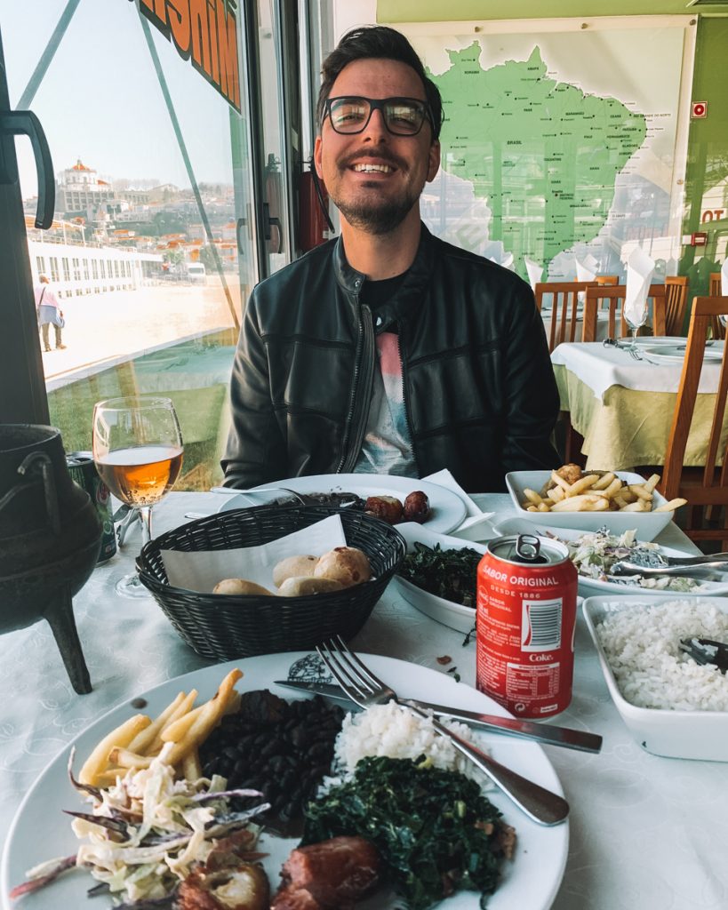 happy man's face eating brazilian food in porto