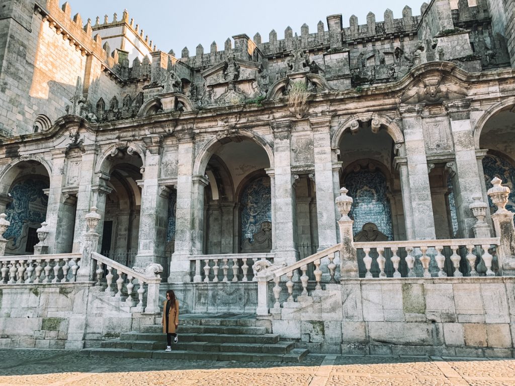 person walking in front of a church in porto