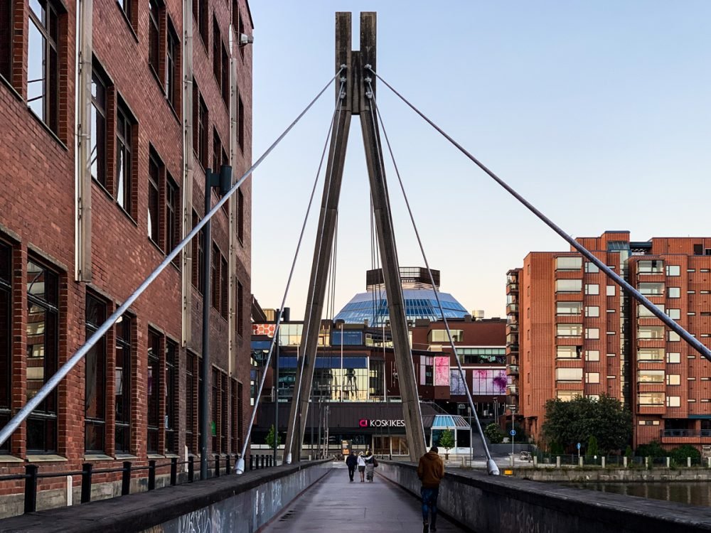 the modern bridge in the modernist part of tampere near the meeting of two lakes