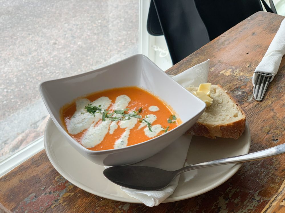 a gazpacho style soup with bread and butter