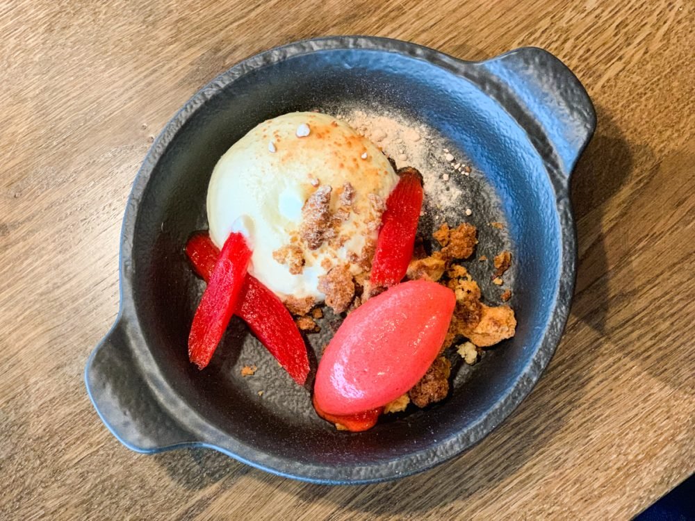 honey yogurt with rhubarb sorbet for dessert in a small cast iron pan