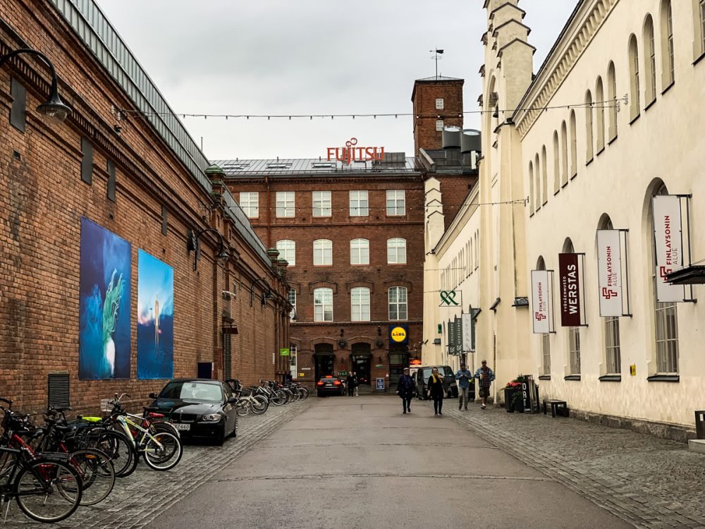 finnish factory area with lots of bikes outside the renovated neighborhood