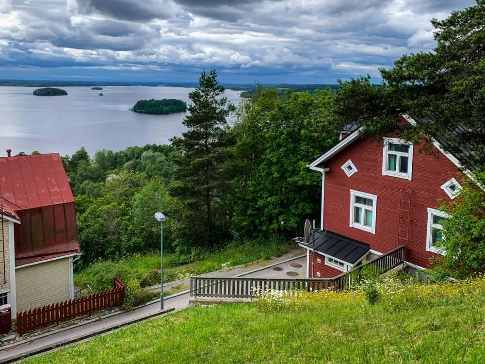 bright red building with a view of lakes and small islets in the background
