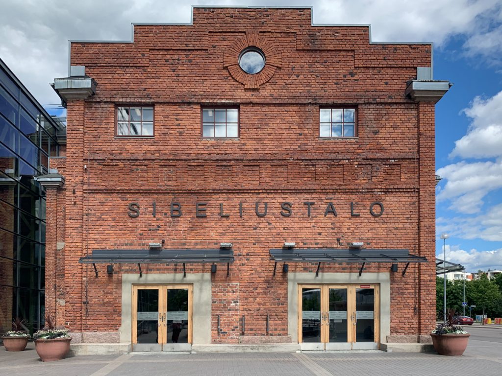 brick building that reads sibeliustalo, the name of the concert hall