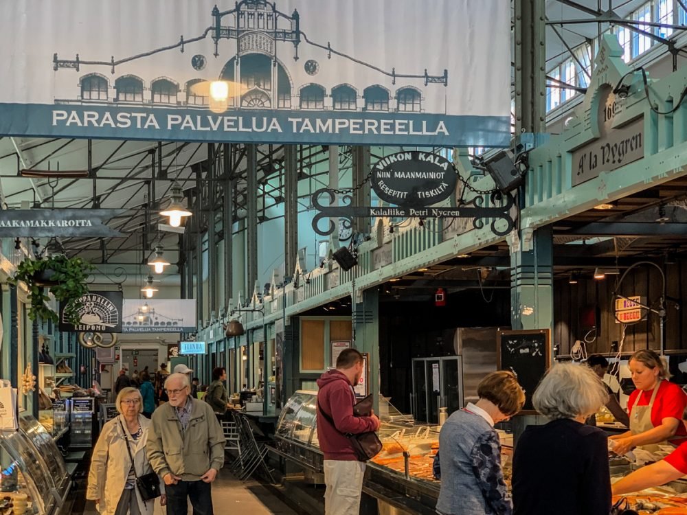 people shopping at the local market hall, a popular concept in finland