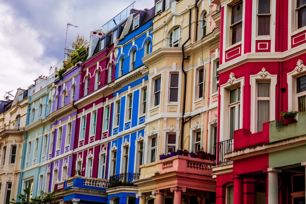 rainbow-colored facades of notting hill townhouses