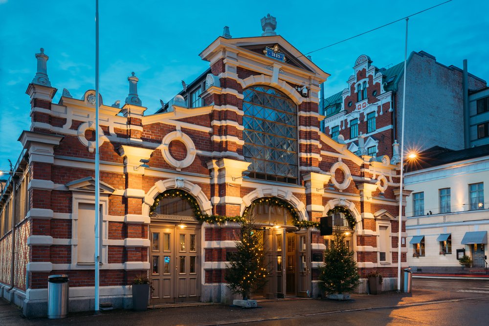 A festive decorated Market Hall in Finland with Christmas trees and Christmas lights