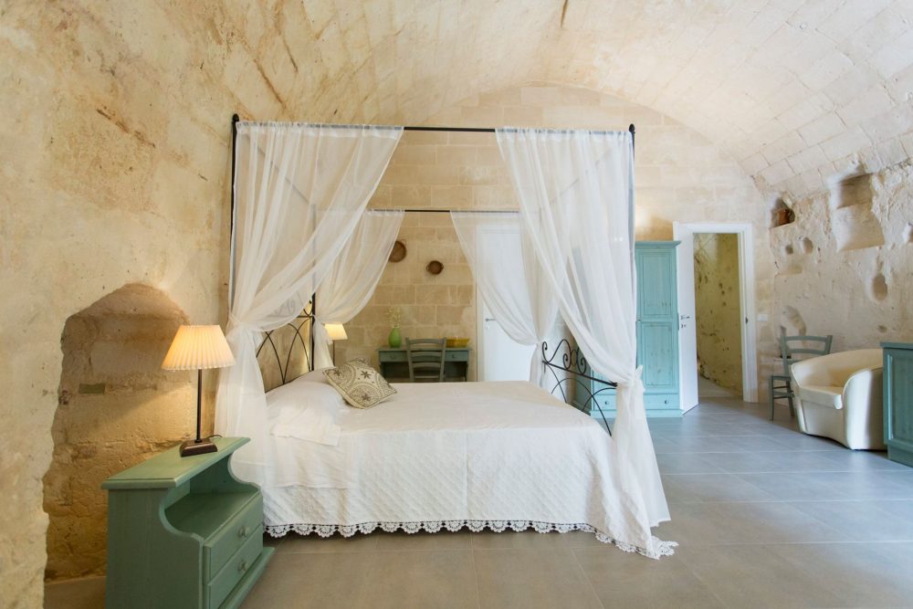 Cave hotel with canopy bed