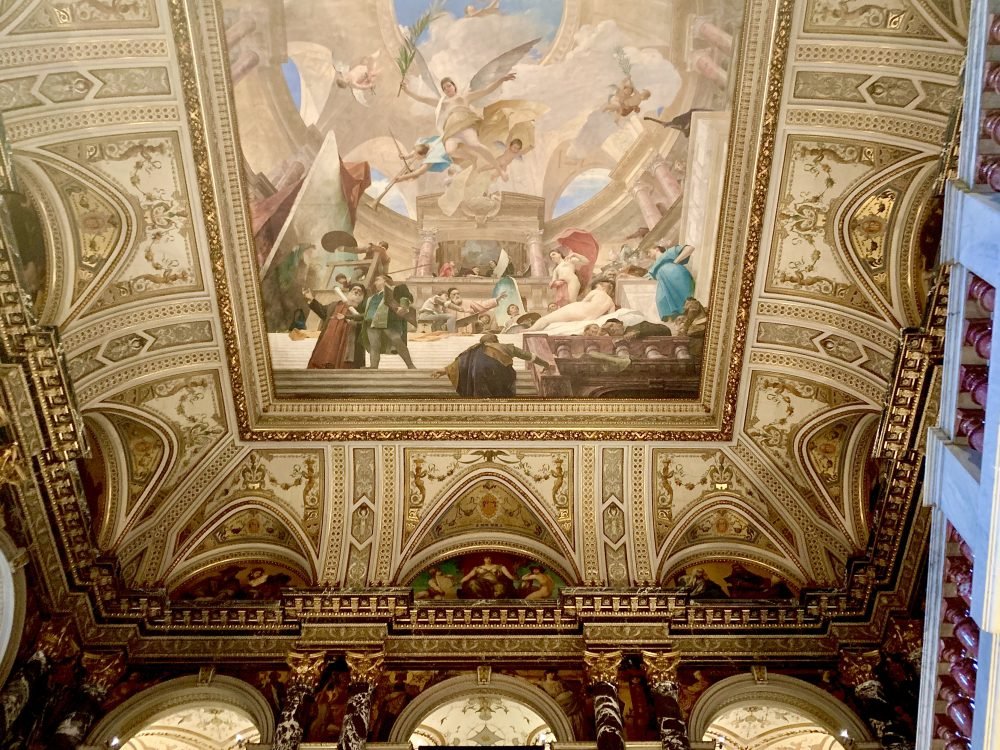 The ceiling at the Art history museum with ornate fresco work and detailing