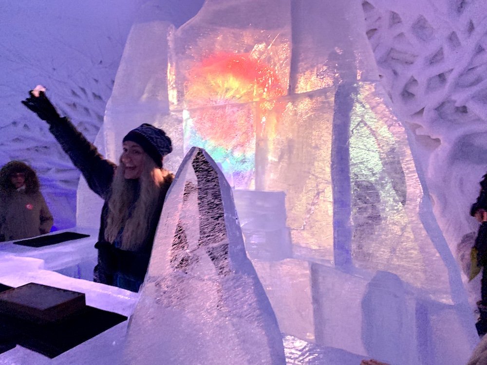 A tour guide giving a cheers at the ice bar in the Tromso Ice Domes restaurant and bar