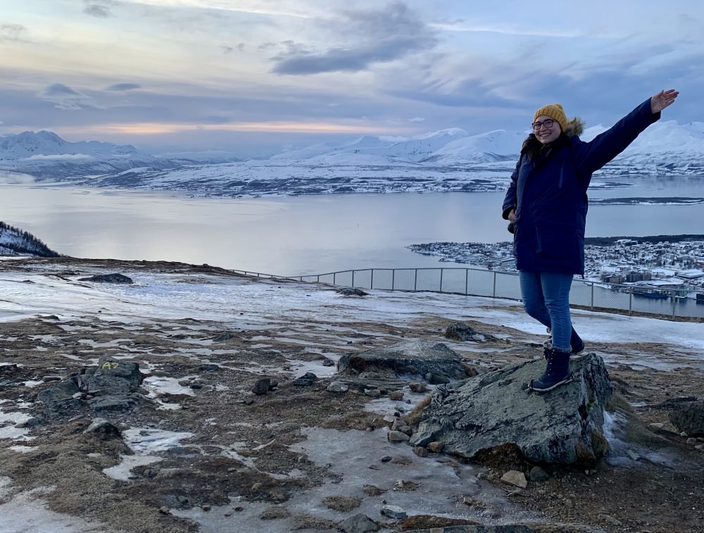 Allison posing at the top of Fjellheisen in Tromso