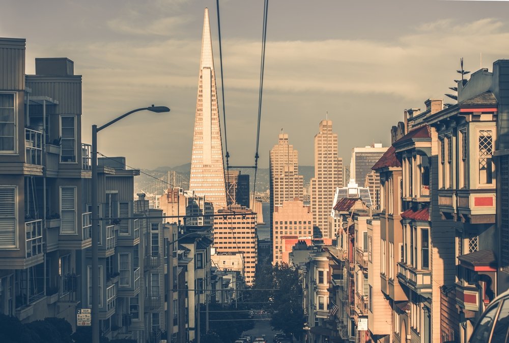 A view of the San Francisco skyline including the triangular, pyramid-shaped TransAmerica building as well as other city buildings.