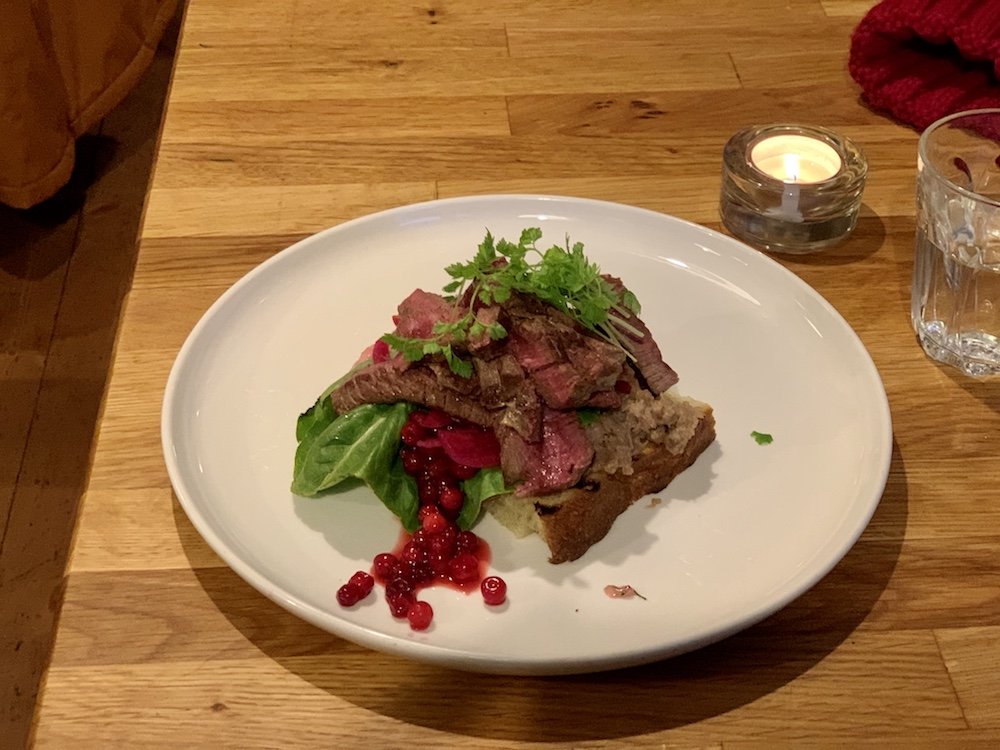 A tasty reindeer open face sandwich at a restaurant