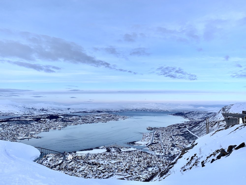 Views from over the cable car up to Fjellheisen looking over the fjord of Tromso and the city just after sunset